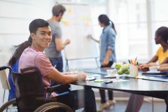 Portrait of happy business executive in meeting at office